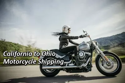 Rider on a silver cruiser motorcycle riding past green hills, California to Ohio motorcycle shipping
