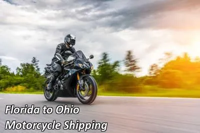 Rider on a dark cruiser motorcycle on an open road, Florida to Ohio motorcycle shipping