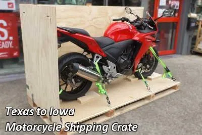 Red sport motorcycle strapped down on a wooden crate base, Texas to Iowa motorcycle shipping crate